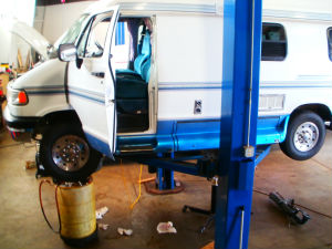 Truck Camper On Service Lift For Transmission Repair Chassis Service